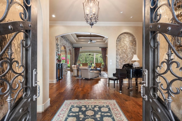 38 Post Shadow Estate Dr, Spring, TX 77389 - entrance foyer featuring arched walkways, dark wood-style flooring, ornamental molding, baseboards, and a tray ceiling
