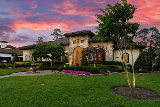 38 Post Shadow Estate Dr, Spring, TX 77389 - mediterranean / spanish house with stone siding, a lawn, and a tile roof