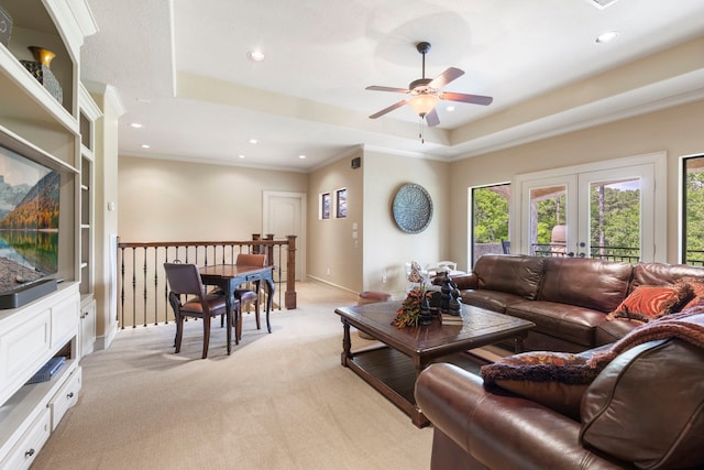 38 Post Shadow Estate Dr, Spring, TX 77389 - living room with light colored carpet, ceiling fan, recessed lighting, a tray ceiling, and baseboards