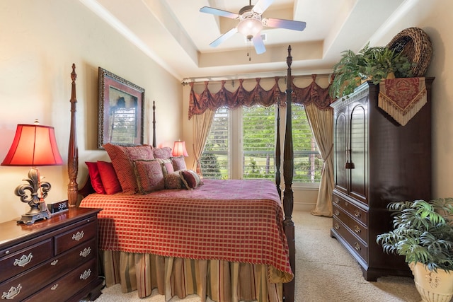 38 Post Shadow Estate Dr, Spring, TX 77389 - bedroom with light colored carpet, a tray ceiling, and a ceiling fan