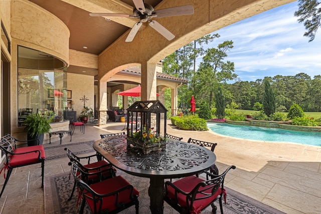 38 Post Shadow Estate Dr, Spring, TX 77389 - view of patio / terrace with a ceiling fan and an outdoor pool
