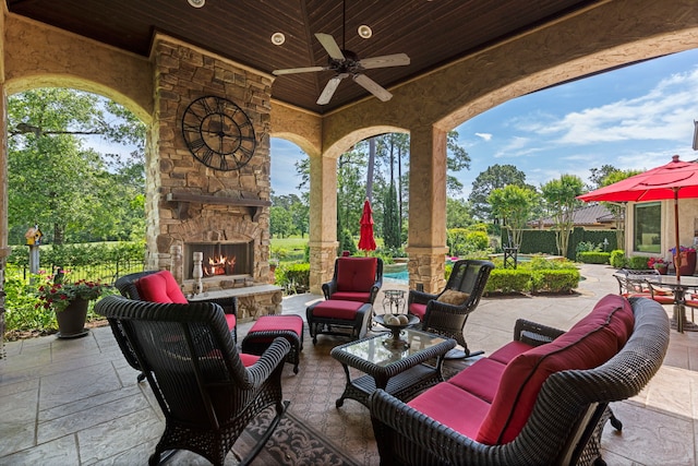 38 Post Shadow Estate Dr, Spring, TX 77389 - view of patio with an outdoor living space with a fireplace and a ceiling fan