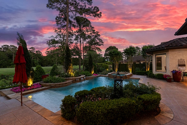 38 Post Shadow Estate Dr, Spring, TX 77389 - pool at dusk featuring a pool with connected hot tub and a patio