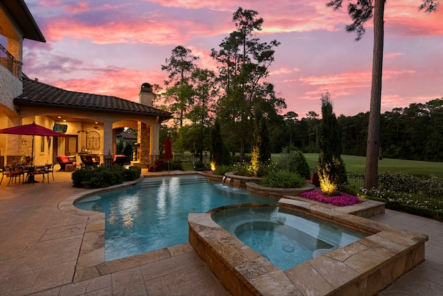 38 Post Shadow Estate Dr, Spring, TX 77389 - pool at dusk with an in-ground hot tub, a patio area, and an outdoor pool