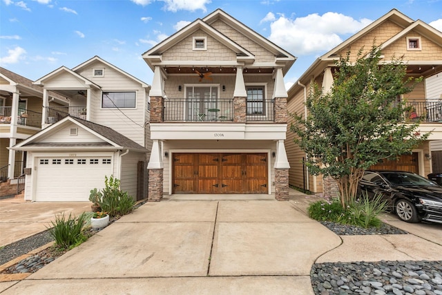 1309 Nashua St Unit A, Houston, TX 77008 - craftsman house featuring a balcony, concrete driveway, stone siding, and a ceiling fan