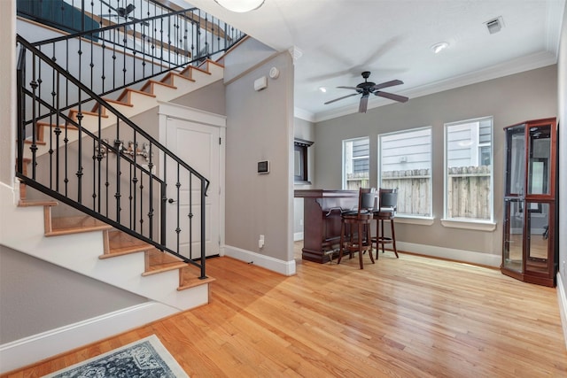 1309 Nashua St Unit A, Houston, TX 77008 - stairs featuring baseboards, wood finished floors, crown molding, a ceiling fan, and recessed lighting