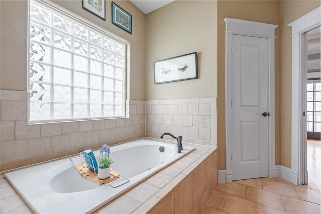 1309 Nashua St Unit A, Houston, TX 77008 - bathroom featuring a garden tub, tile patterned flooring, and baseboards