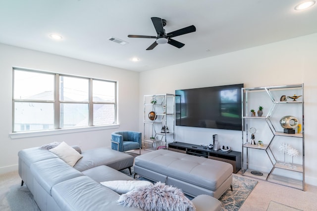 living room with carpet floors, a ceiling fan, recessed lighting, and baseboards
