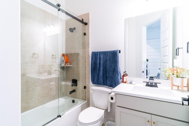 bathroom with vanity, combined bath / shower with glass door, and toilet