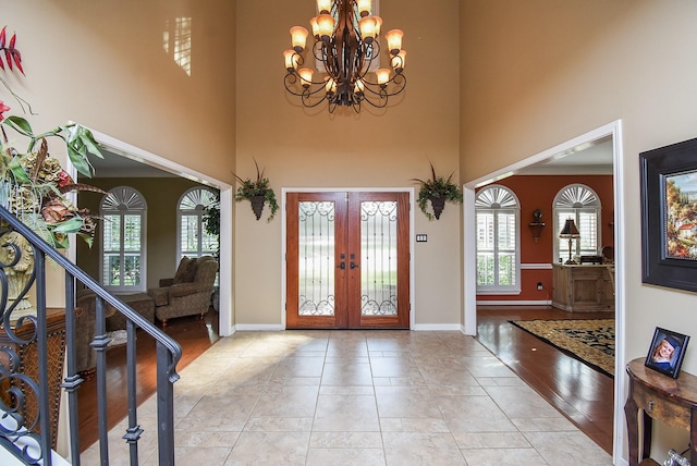 14 Wickham Ct, Sugar Land, TX 77479 - entryway with a towering ceiling, french doors, a chandelier, baseboards, and stairs