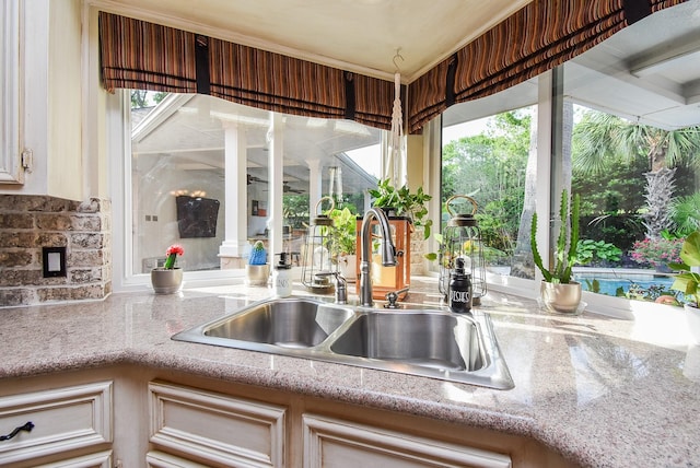 14 Wickham Ct, Sugar Land, TX 77479 - kitchen featuring a sink and tasteful backsplash