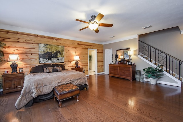 14 Wickham Ct, Sugar Land, TX 77479 - bedroom with wooden walls, wood finished floors, crown molding, and a ceiling fan