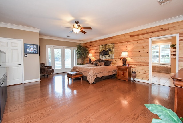 14 Wickham Ct, Sugar Land, TX 77479 - bedroom featuring french doors, multiple windows, ornamental molding, wood finished floors, and baseboards