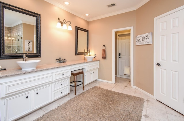 14 Wickham Ct, Sugar Land, TX 77479 - bathroom featuring tile patterned flooring, ornamental molding, a shower stall, double vanity, and baseboards