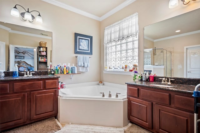 4635 Countrymeadows Dr, Spring, TX 77388 - bathroom with a shower stall, a garden tub, two vanities, and crown molding