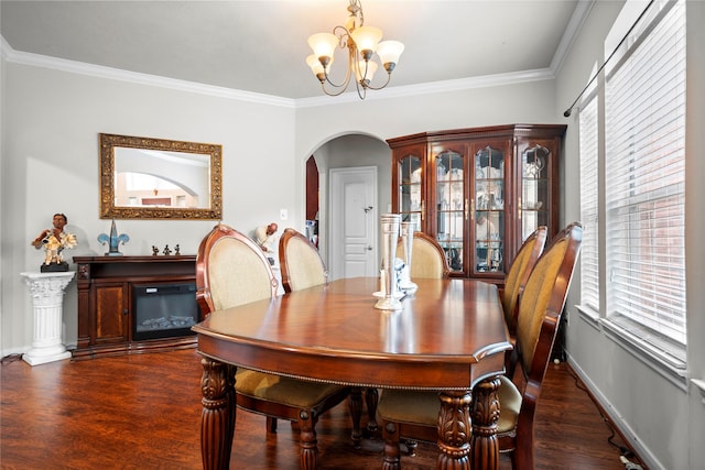 4635 Countrymeadows Dr, Spring, TX 77388 - dining space with arched walkways, a chandelier, wood finished floors, crown molding, and baseboards