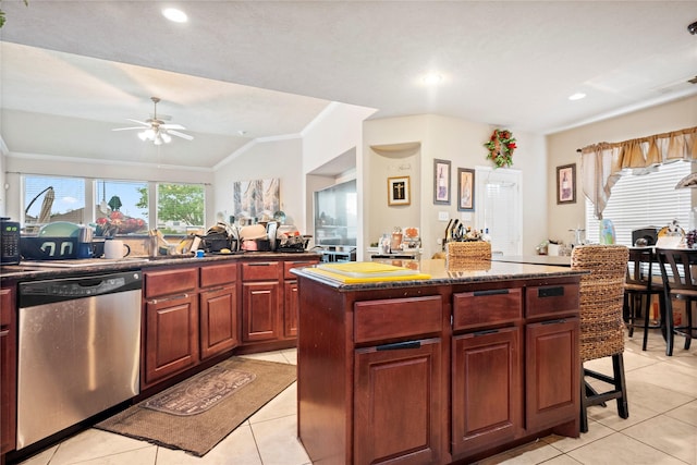 4635 Countrymeadows Dr, Spring, TX 77388 - kitchen featuring stainless steel dishwasher, light tile patterned floors, ornamental molding, a kitchen island, and ceiling fan