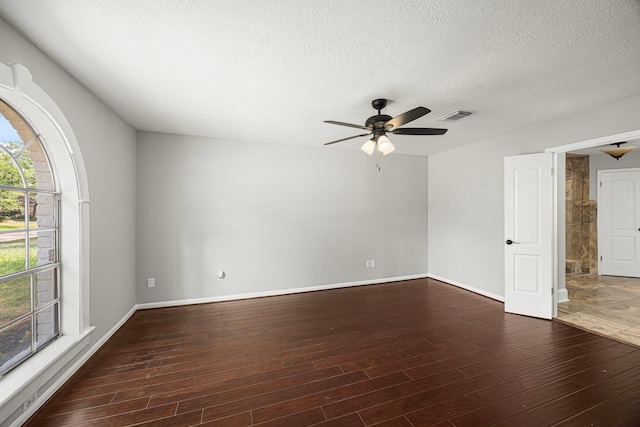 15115 Gladebrook Dr, Houston, TX 77068 - empty room featuring wood finished floors, ceiling fan, a textured ceiling, and baseboards
