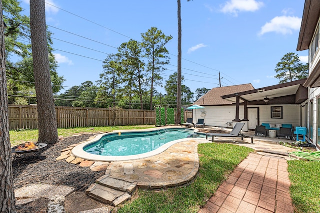 15115 Gladebrook Dr, Houston, TX 77068 - view of swimming pool with a fire pit, ceiling fan, a patio, and a fenced backyard