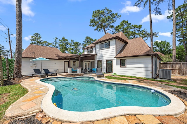 15115 Gladebrook Dr, Houston, TX 77068 - view of swimming pool with a patio, central AC, a fenced backyard, and a pool with connected hot tub
