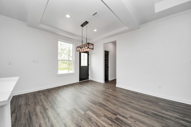 1029 Gazing Pine St, Huffman, TX 77336 - unfurnished dining area featuring a tray ceiling, dark wood-style flooring, baseboards, and recessed lighting