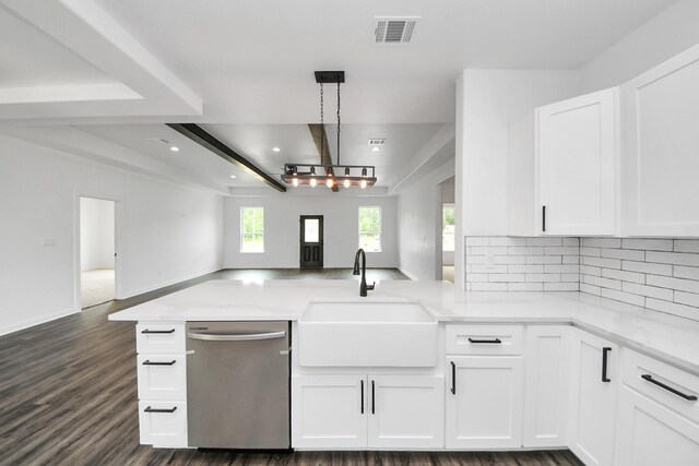 1029 Gazing Pine St, Huffman, TX 77336 - kitchen featuring dishwasher, open floor plan, a sink, a peninsula, and decorative backsplash