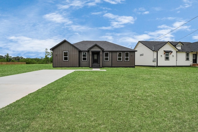 1029 Gazing Pine St, Huffman, TX 77336 - view of front facade with a front yard and board and batten siding