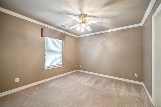 empty room with carpet, a ceiling fan, baseboards, and ornamental molding