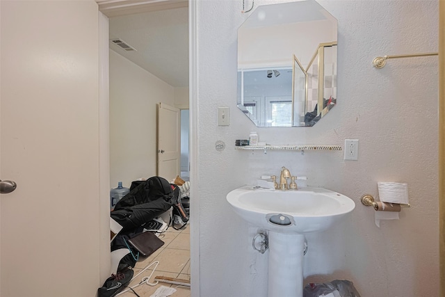 bathroom with tile patterned floors