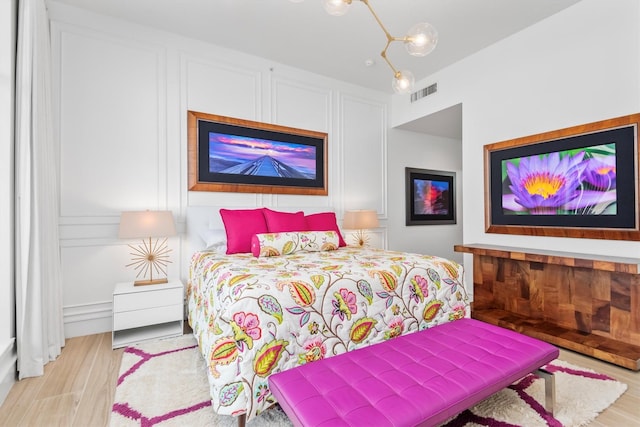 1 Waterway Ct Unit 4B, The Woodlands, TX 77380 - bedroom with wood finished floors
