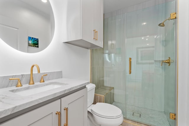 1 Waterway Ct Unit 4B, The Woodlands, TX 77380 - bathroom featuring toilet, a shower stall, and vanity