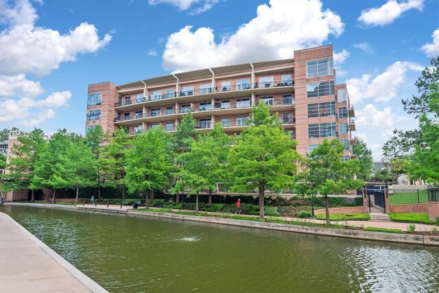1 Waterway Ct Unit 4B, The Woodlands, TX 77380 - view of community with a water view