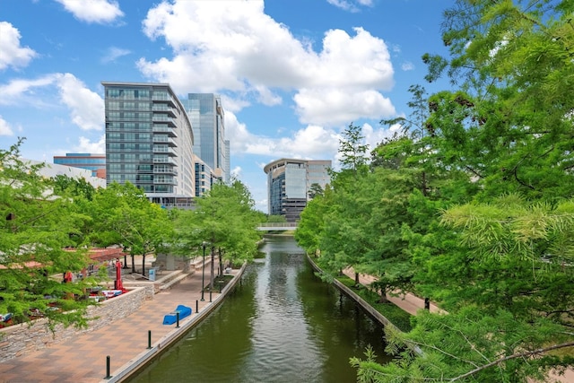 1 Waterway Ct Unit 4B, The Woodlands, TX 77380 - view of home's community with a water view and a city view
