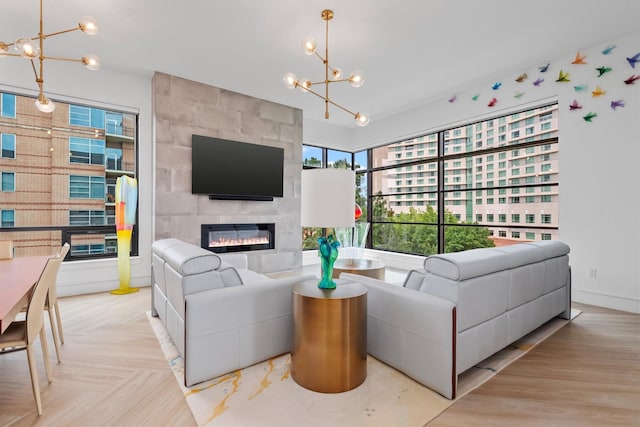 1 Waterway Ct Unit 4B, The Woodlands, TX 77380 - living room with a chandelier and a tiled fireplace
