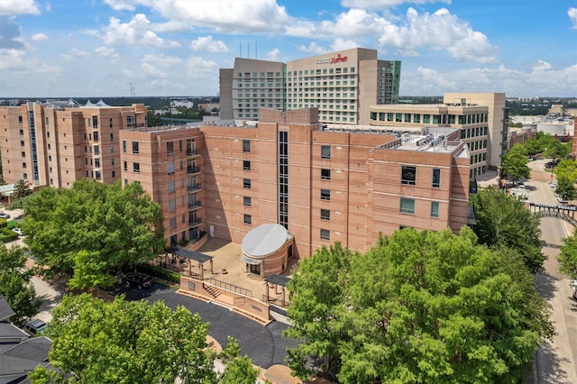 1 Waterway Ct Unit 4B, The Woodlands, TX 77380 - view of building exterior featuring a city view