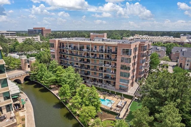 1 Waterway Ct Unit 4B, The Woodlands, TX 77380 - aerial view of apartment complex, a pool area, and a nearby body of water