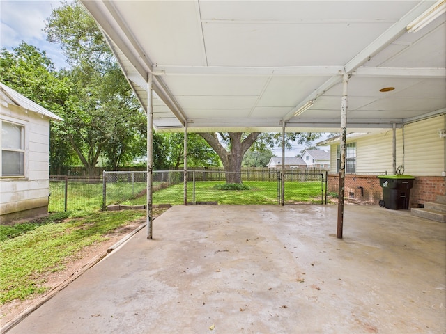 view of patio / terrace featuring a carport and fence
