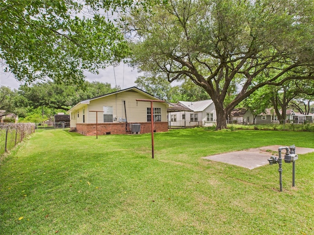 view of yard featuring central AC unit