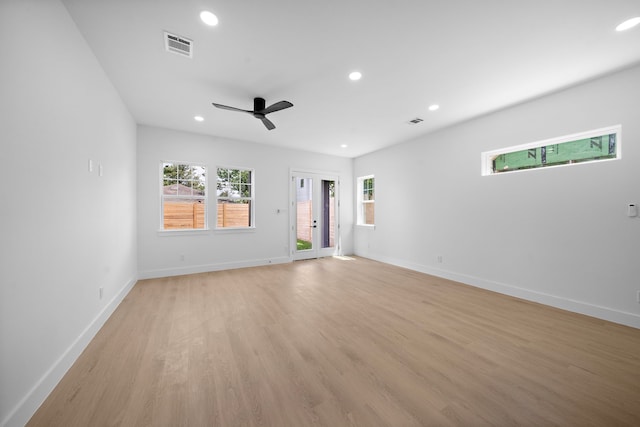 1307 Amundsen St N, Houston, TX 77009 - empty room featuring recessed lighting, healthy amount of natural light, light wood-type flooring, baseboards, and ceiling fan
