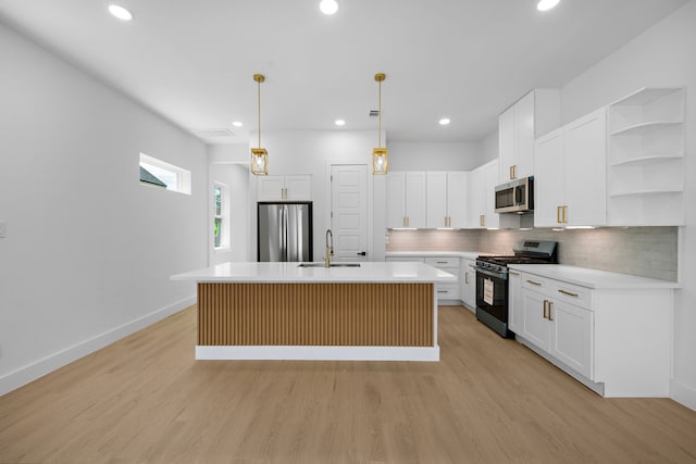 1307 Amundsen St N, Houston, TX 77009 - kitchen featuring stainless steel appliances, open shelves, a sink, light wood-type flooring, and decorative backsplash