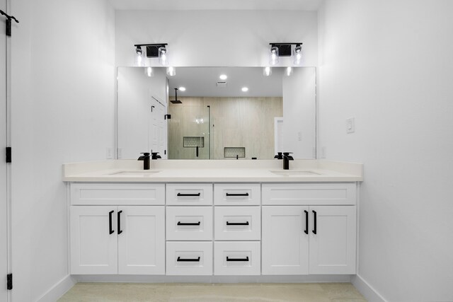 1307 Amundsen St N, Houston, TX 77009 - full bath with a stall shower, baseboards, double vanity, and recessed lighting