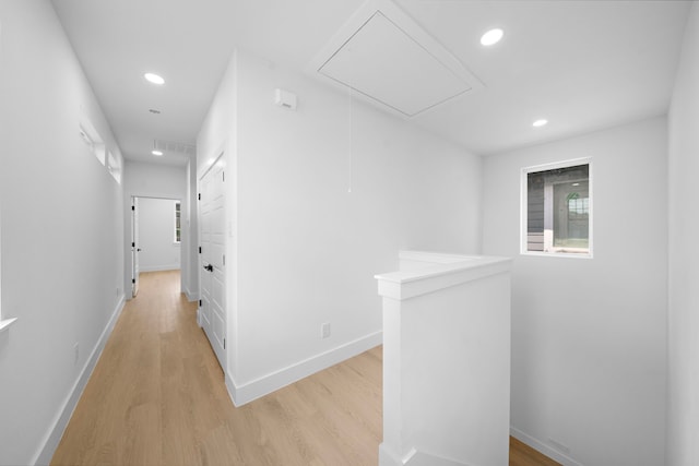1307 Amundsen St N, Houston, TX 77009 - corridor with attic access, an upstairs landing, light wood-style flooring, recessed lighting, and baseboards