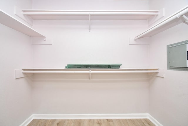 6633 W Airport Unit 1103, Houston, TX 77035 - walk in closet with wood finished floors and electric panel