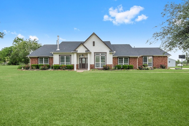 34334 Howell Rd, Waller, TX 77484 - modern farmhouse featuring brick siding, a front lawn, and roof with shingles