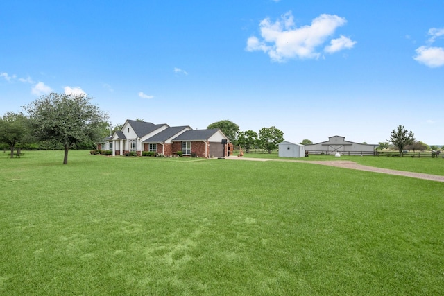 34334 Howell Rd, Waller, TX 77484 - view of front facade with a storage unit and an outdoor structure