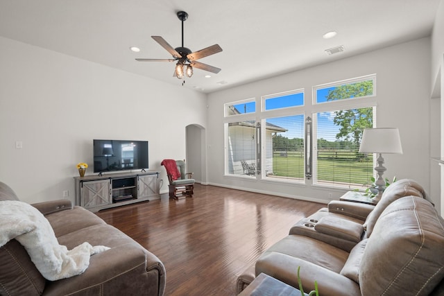 34334 Howell Rd, Waller, TX 77484 - living room with arched walkways, ceiling fan, wood finished floors, recessed lighting, and baseboards