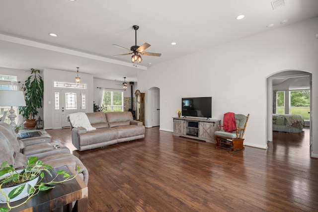 34334 Howell Rd, Waller, TX 77484 - living area featuring arched walkways, a ceiling fan, wood finished floors, recessed lighting, and baseboards