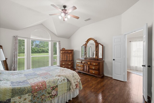 34334 Howell Rd, Waller, TX 77484 - bedroom with multiple windows, dark wood-style floors, vaulted ceiling, ceiling fan, and baseboards