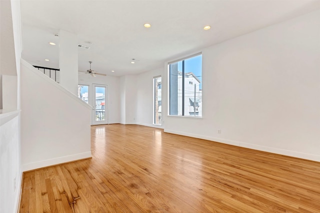 unfurnished living room featuring light wood-style floors, recessed lighting, baseboards, and ceiling fan