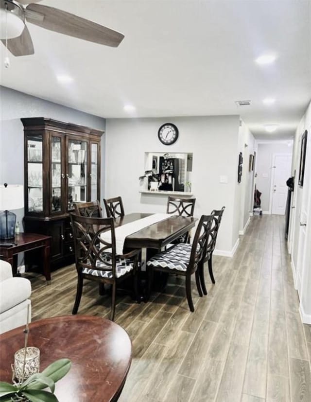 2112 Greenbriar Colony Dr, Houston, TX 77032 - dining space with light wood-style floors, ceiling fan, and baseboards